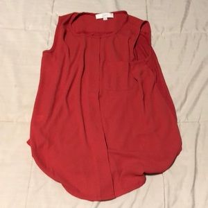 Red sleeveless blouse